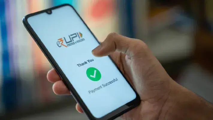 A phone showing a successful UPI payment